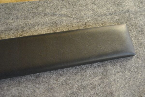 A black leather case sitting on top of a table.