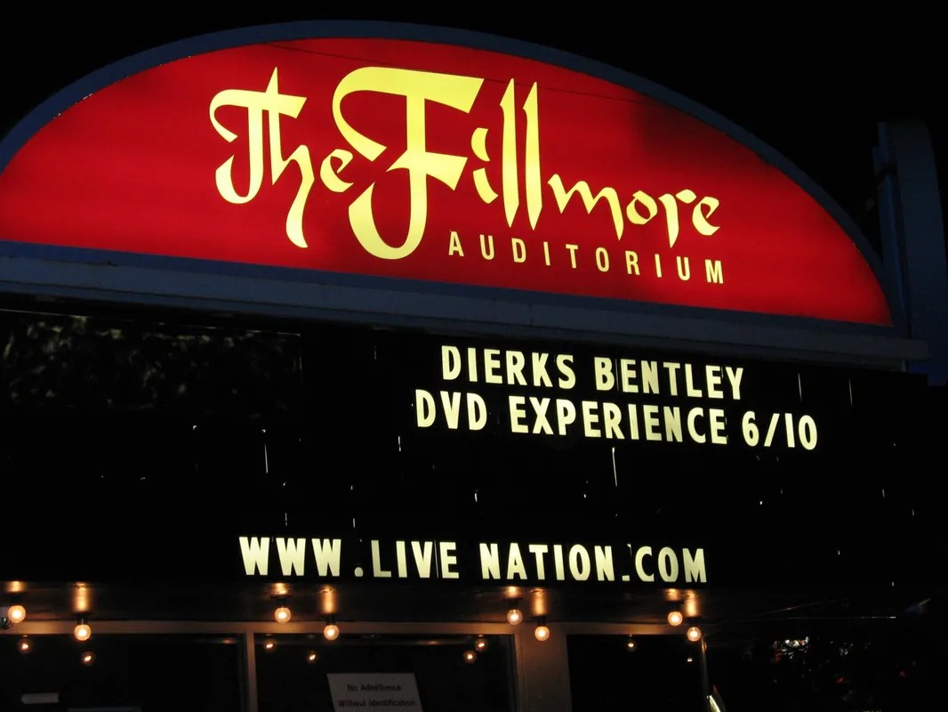 The fillmore auditorium sign is lit up at night.